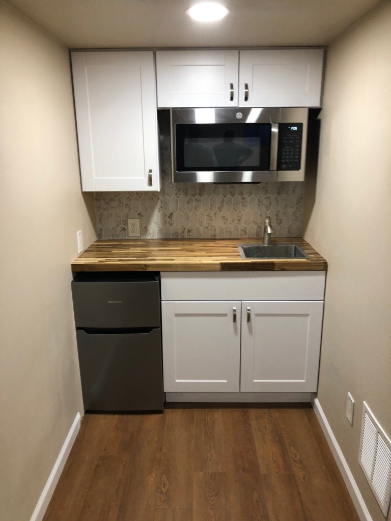 Kitchenette. basement remodel. butcher block countertop. Shaker cabinets