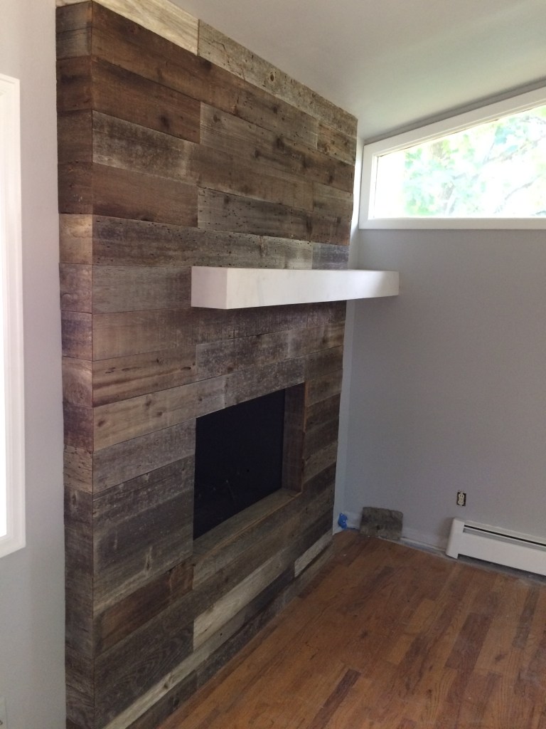 Barn door. Wood barn door. Custom built barn door. Luxury vinyl plank flooring. Basement remodel. Recess lighting