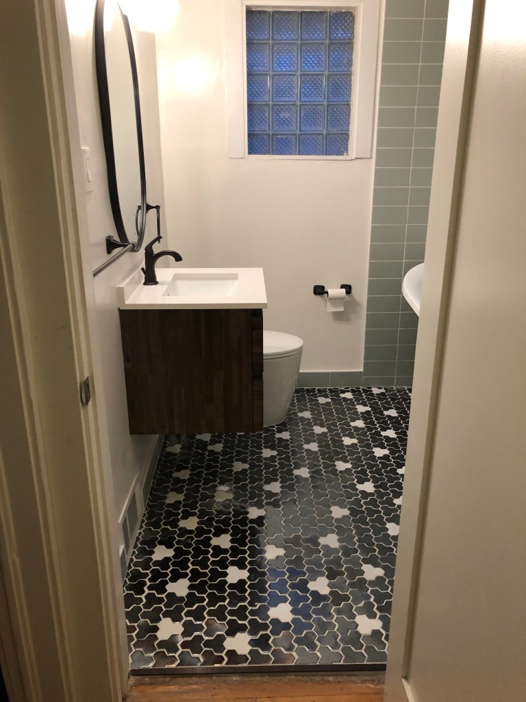 Bathroom update. Mosaic tile floor. grey subway tile. Shower niche. freestanding tub. Clawfoot tub and shower. Matte black. Modern and contemporary bathroom.